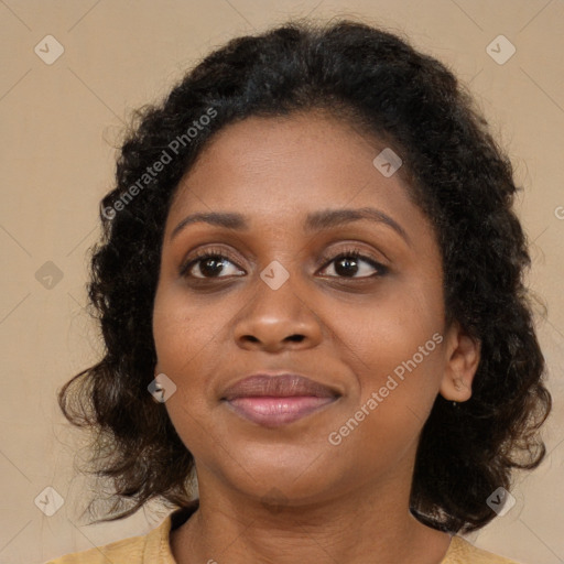 Joyful black young-adult female with medium  brown hair and brown eyes