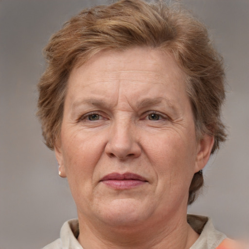 Joyful white middle-aged female with short  brown hair and blue eyes