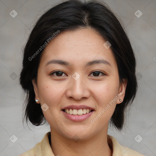 Joyful asian young-adult female with medium  brown hair and brown eyes