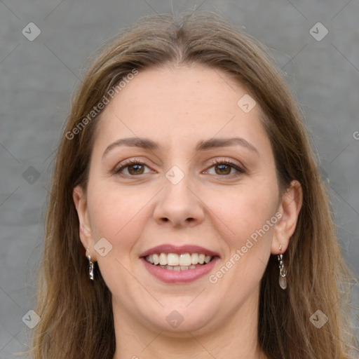 Joyful white young-adult female with long  brown hair and green eyes