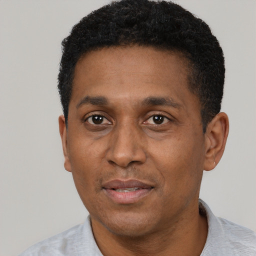 Neutral latino adult male with short  black hair and brown eyes