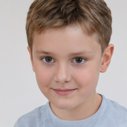 Joyful white child male with short  brown hair and brown eyes