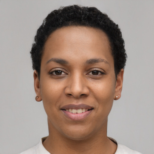 Joyful latino young-adult female with short  black hair and brown eyes