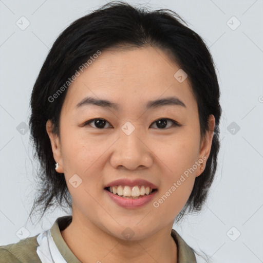 Joyful asian young-adult female with medium  brown hair and brown eyes