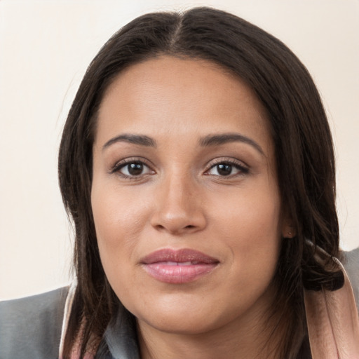 Joyful white young-adult female with long  brown hair and brown eyes