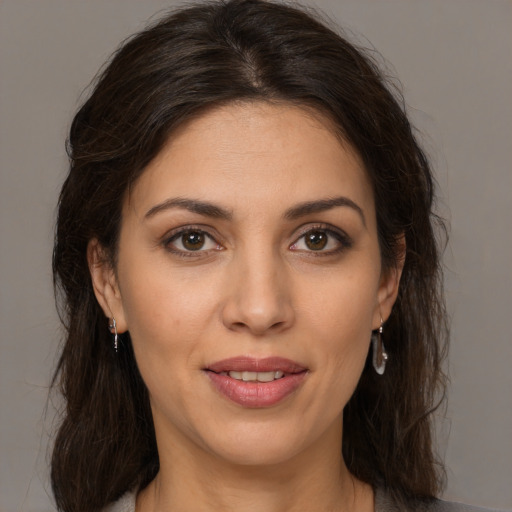 Joyful white young-adult female with medium  brown hair and brown eyes