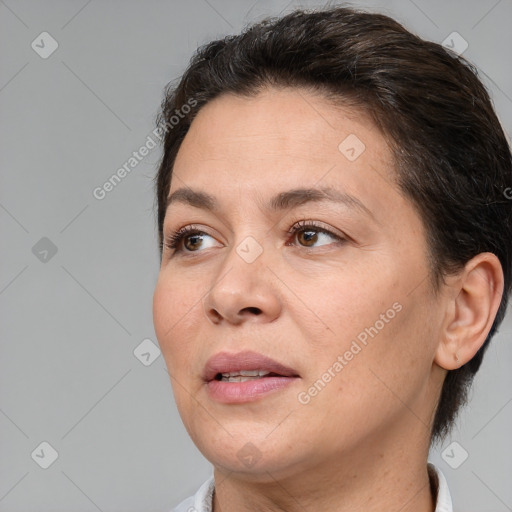 Joyful white adult female with short  brown hair and brown eyes