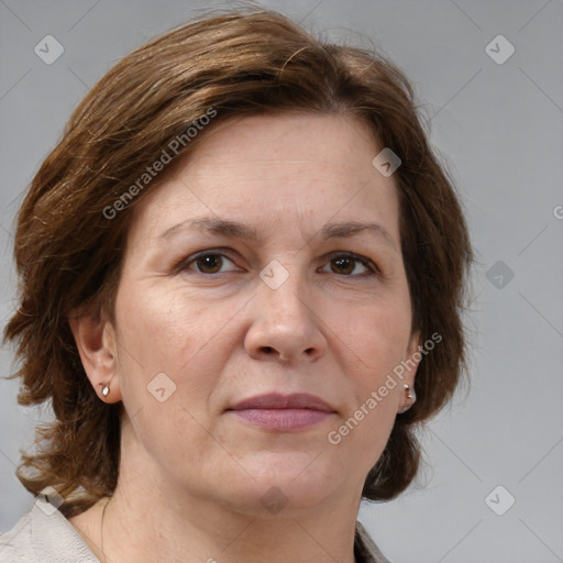 Joyful white adult female with medium  brown hair and grey eyes