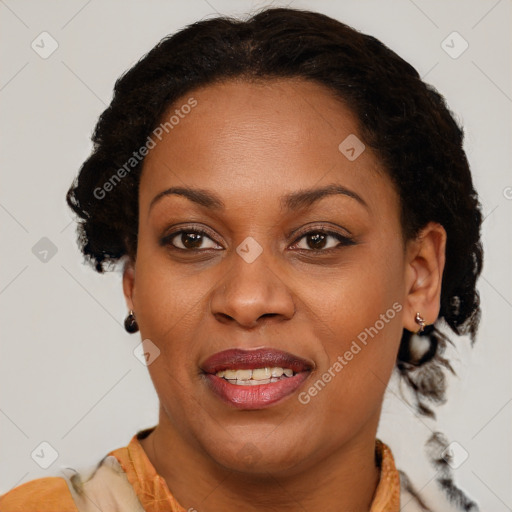 Joyful black adult female with medium  brown hair and brown eyes