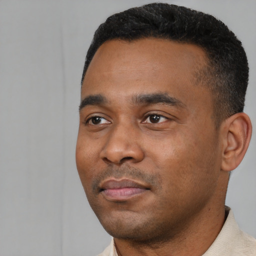 Neutral black young-adult male with short  black hair and brown eyes