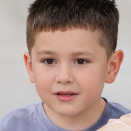 Joyful white child male with short  brown hair and brown eyes