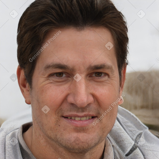 Joyful white adult male with short  brown hair and brown eyes