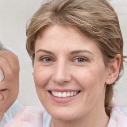 Joyful white young-adult female with medium  brown hair and blue eyes