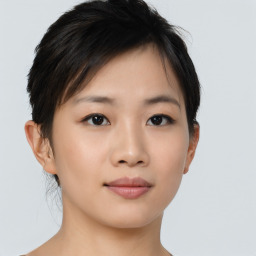 Joyful asian young-adult female with short  black hair and brown eyes