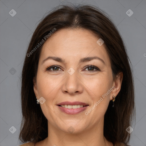 Joyful white adult female with medium  brown hair and brown eyes