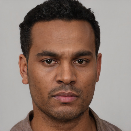 Neutral black young-adult male with short  black hair and brown eyes