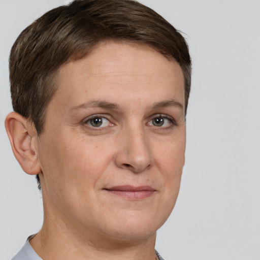 Joyful white adult female with short  brown hair and brown eyes