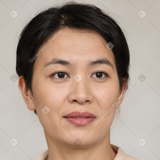 Joyful asian young-adult female with short  brown hair and brown eyes