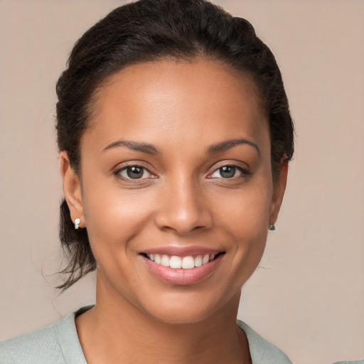 Joyful white young-adult female with short  brown hair and brown eyes