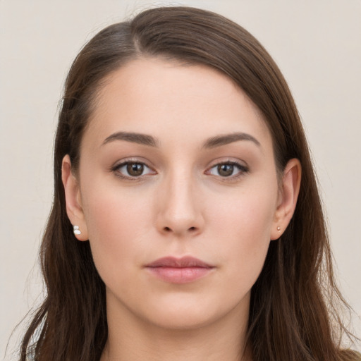 Neutral white young-adult female with long  brown hair and brown eyes