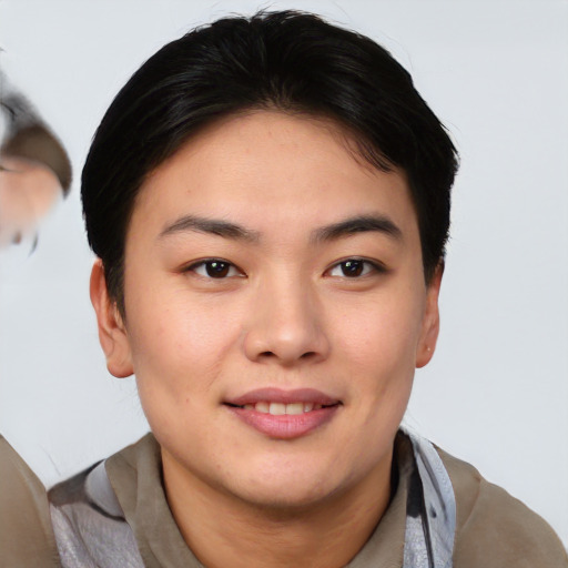 Joyful asian young-adult female with short  brown hair and brown eyes