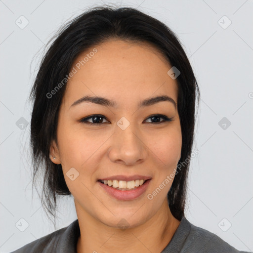 Joyful asian young-adult female with long  black hair and brown eyes