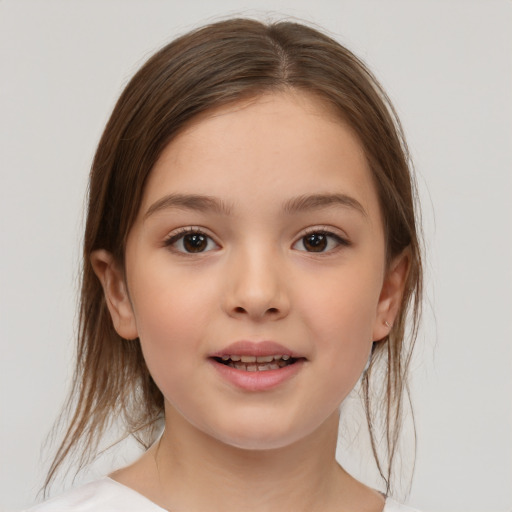 Joyful white child female with medium  brown hair and brown eyes