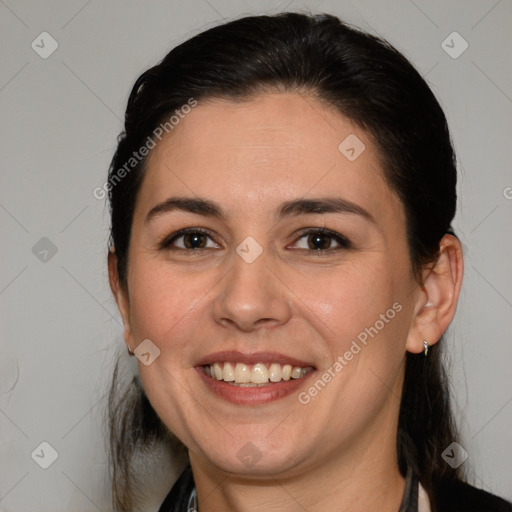 Joyful white adult female with medium  brown hair and brown eyes