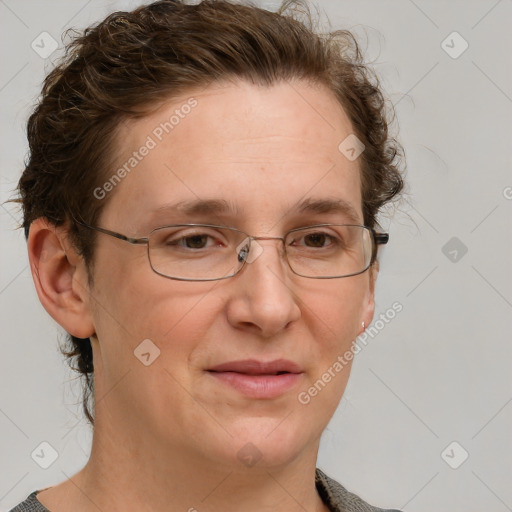 Joyful white adult female with short  brown hair and grey eyes