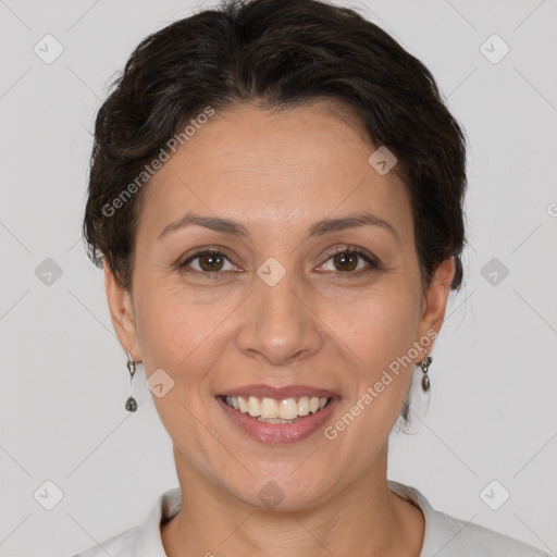 Joyful white adult female with short  brown hair and brown eyes