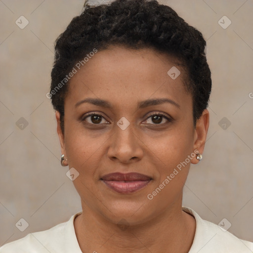 Joyful black young-adult female with short  brown hair and brown eyes