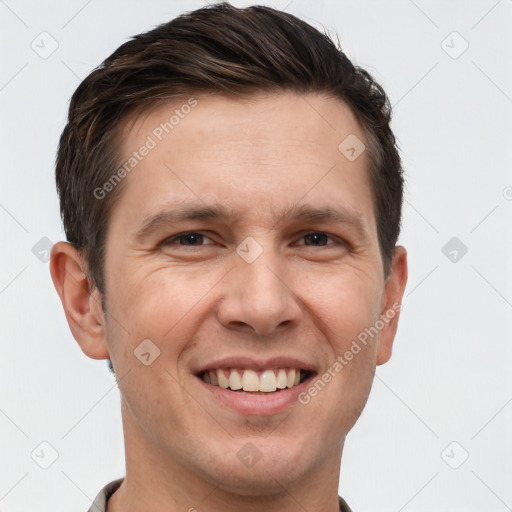 Joyful white adult male with short  brown hair and brown eyes