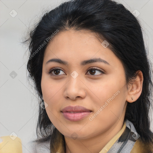 Joyful latino young-adult female with medium  black hair and brown eyes