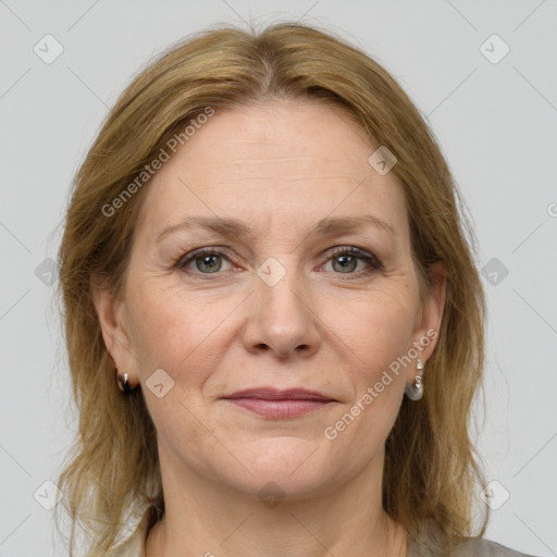 Joyful white adult female with medium  brown hair and grey eyes