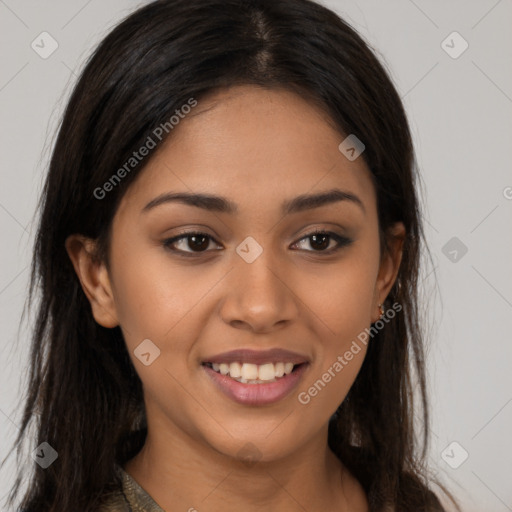 Joyful latino young-adult female with long  brown hair and brown eyes