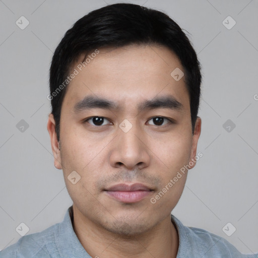 Joyful asian young-adult male with short  black hair and brown eyes