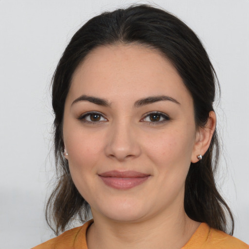 Joyful white young-adult female with medium  brown hair and brown eyes