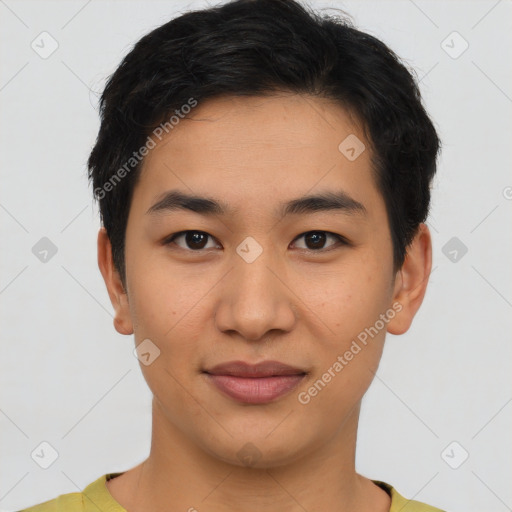 Joyful asian young-adult male with short  brown hair and brown eyes