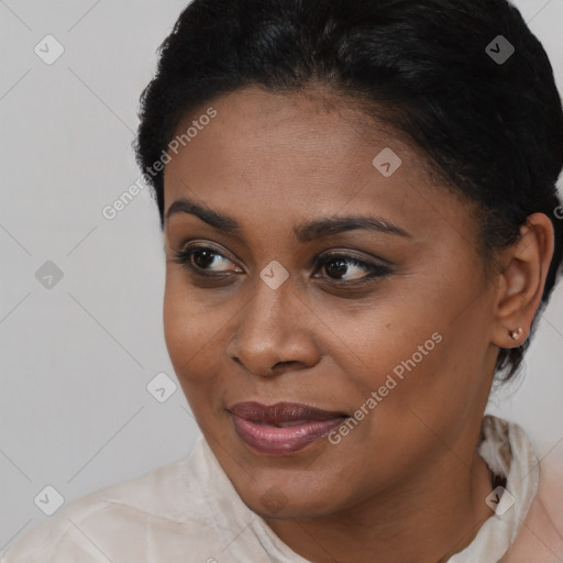 Joyful latino young-adult female with short  black hair and brown eyes