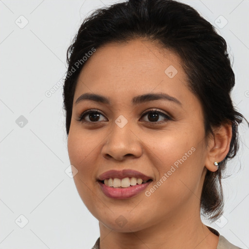 Joyful latino young-adult female with medium  brown hair and brown eyes