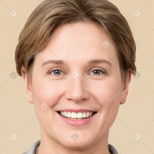 Joyful white young-adult female with short  brown hair and grey eyes