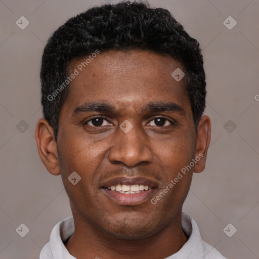 Joyful black young-adult male with short  black hair and brown eyes