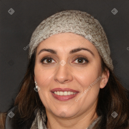 Joyful white adult female with long  brown hair and brown eyes