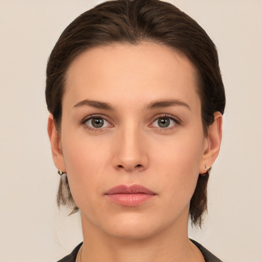 Neutral white young-adult female with medium  brown hair and brown eyes