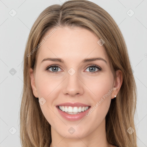 Joyful white young-adult female with long  brown hair and grey eyes