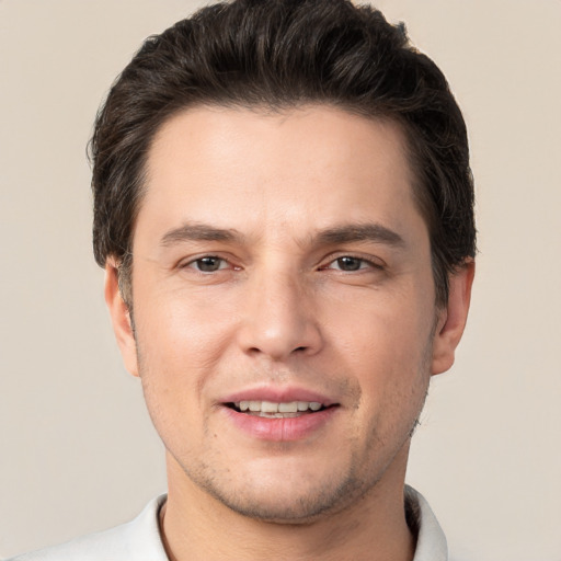 Joyful white young-adult male with short  brown hair and brown eyes