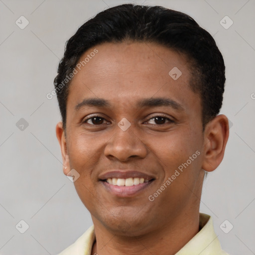 Joyful latino young-adult male with short  black hair and brown eyes