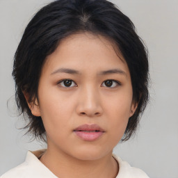 Neutral asian young-adult female with medium  brown hair and brown eyes