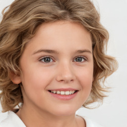 Joyful white child female with medium  brown hair and brown eyes