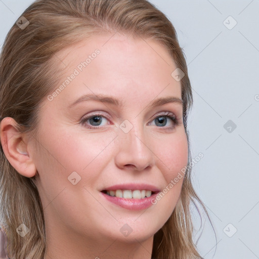 Joyful white young-adult female with long  brown hair and blue eyes